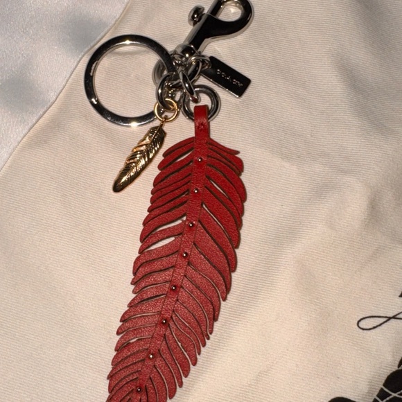 Coach Handbags - Coach Red Feather Keychain with Gold Charm